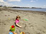 A younger Guest enjoying the sand out in front of the Cottage
